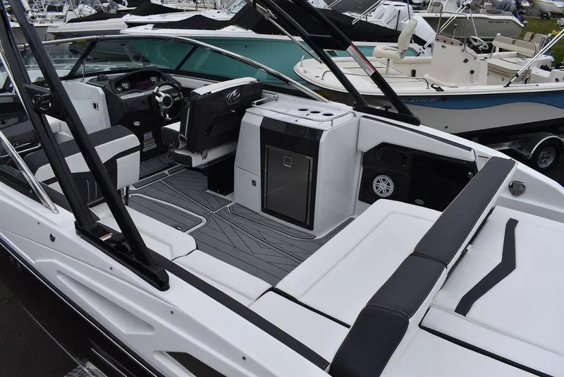 Slide: The Image of 2024 Monterey 275SS boat interior with modern seating and control panel. - 22