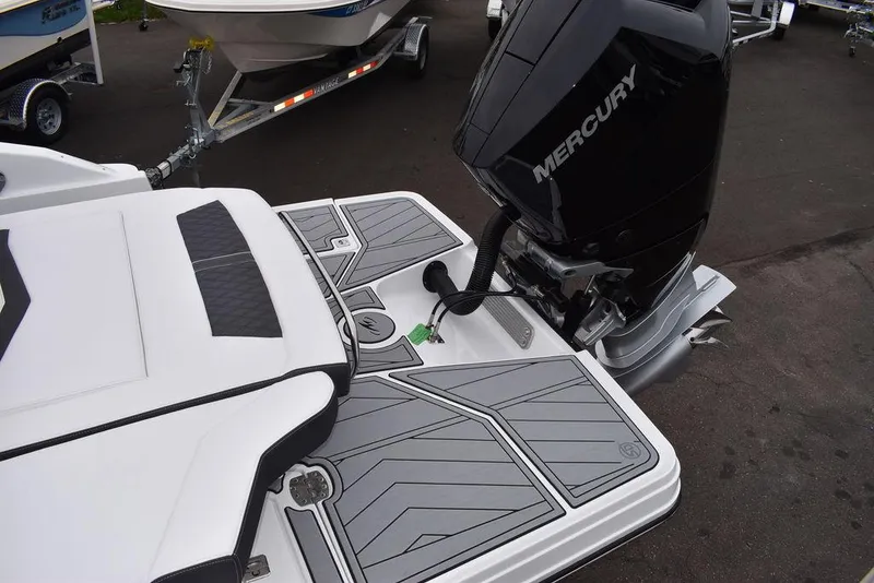 Slide: The Image of 2024 Monterey 275SS boat with Mercury outboard engine and swim platform. - 23
