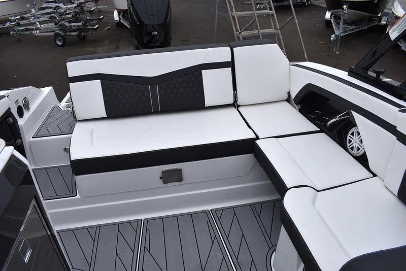 Slide: The Image of 2024 Monterey 275SS boat interior with white and black seating. - 32