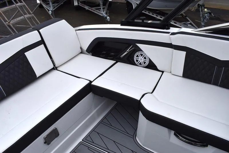 Slide: The Image of 2024 Monterey 275SS boat interior with white and black seating. - 33