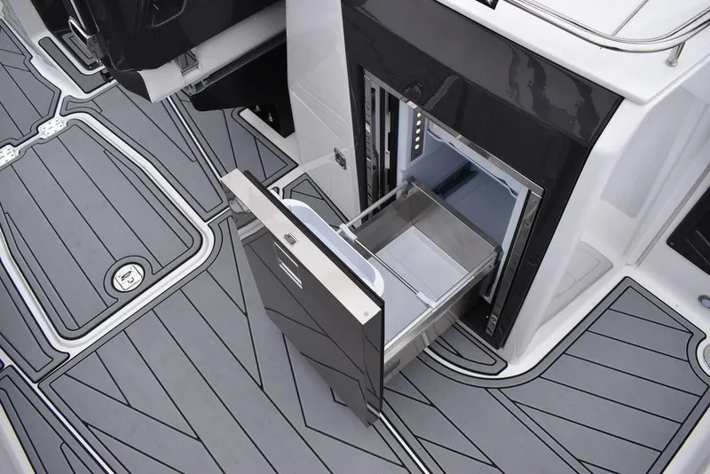 Slide: The Image of 2024 Monterey 275SS boat with open storage compartment. - 47