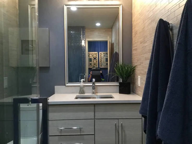 Slide: The Image of Narrow hallway with blue walls, wooden floor, and recessed lighting on Adonia Azul Trip. - 12