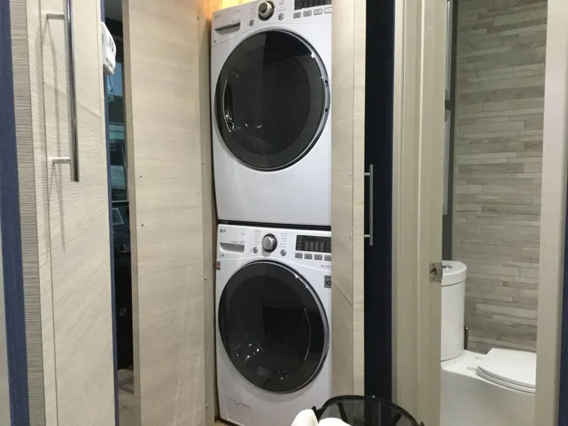 Slide: The Image of Luxurious bedroom interior in Adonia Azul Trip RV, featuring elegant bedding and modern lighting. - 17