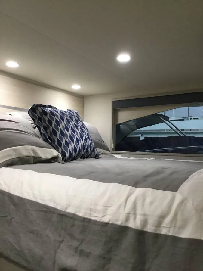 Slide: The Image of Modern bedroom with blue bedding, wall-mounted TV, and framed artwork, Adonia Azul Trip 2017. - 18