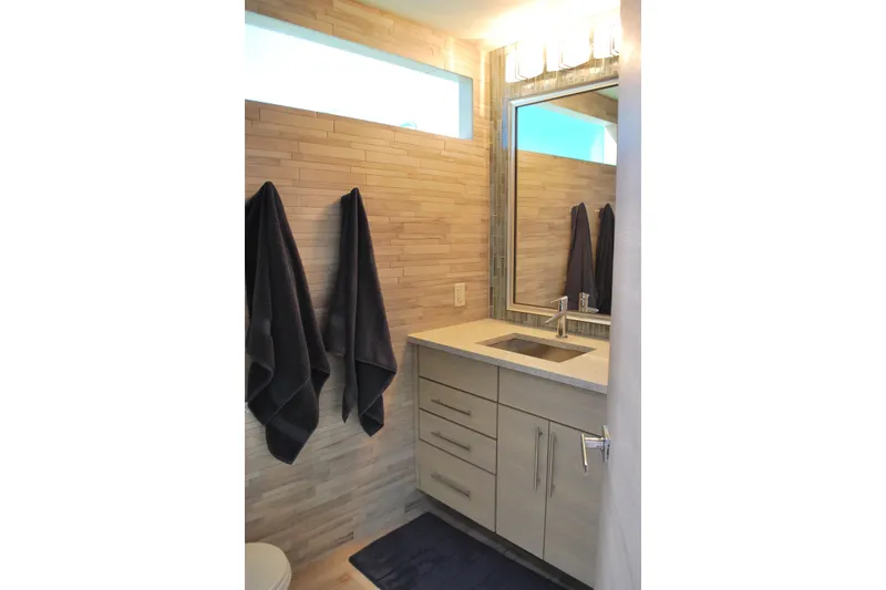Slide: The Image of Modern bathroom with wooden accents, sleek vanity, and soft lighting from Adonia's Azul Trip 2017. - 22