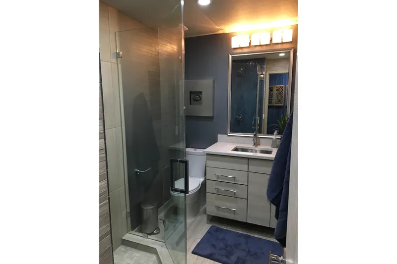 Slide: The Image of Modern bathroom with glass shower, sleek vanity, and blue accents, from Adonia Azul Trip 2017. - 25