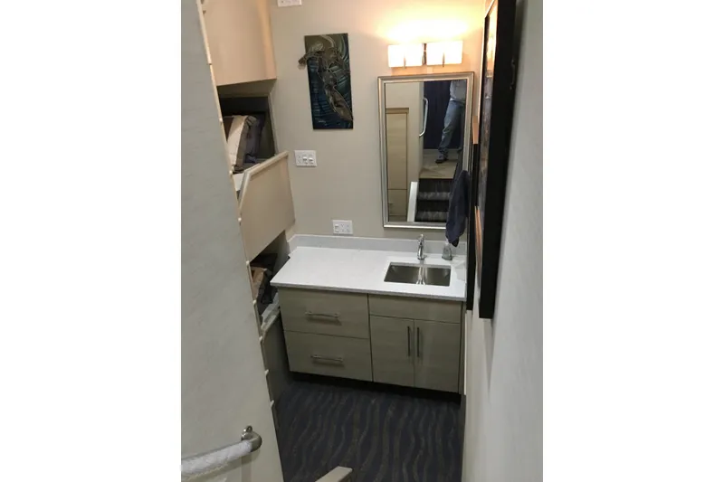 Slide: The Image of Compact bathroom with modern sink, mirror, and lighting on Adonia Azul Trip #1, 2017. - 26