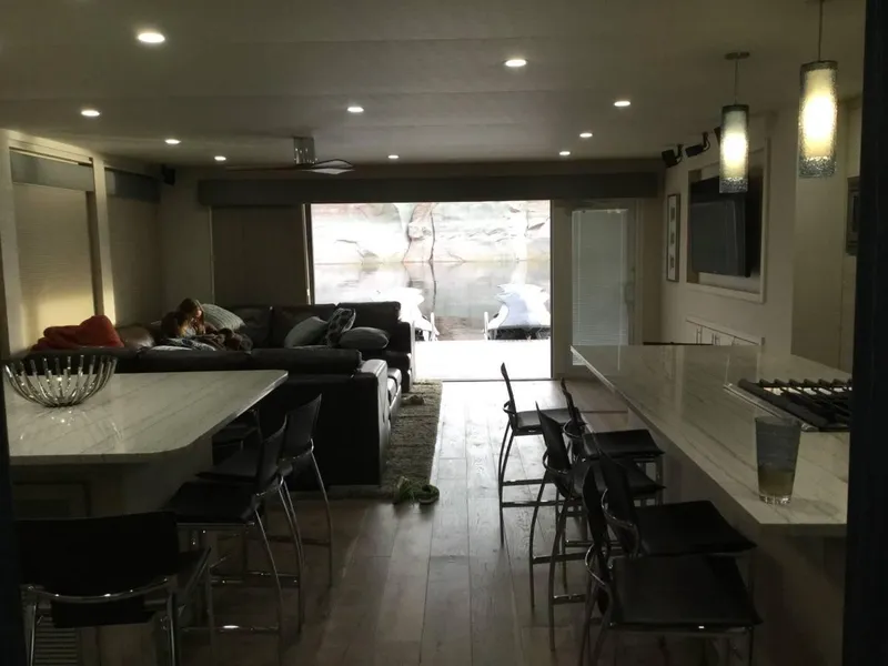 Slide: The Image of Modern kitchen and living area in Adonia Azul Trip, 2017, featuring sleek design and cozy seating. - 3