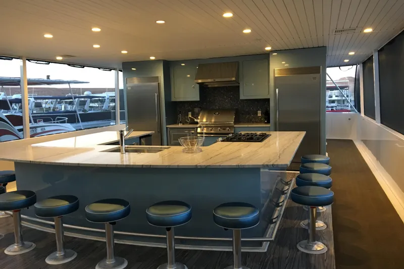 Slide: The Image of Luxurious yacht kitchen with marble island, bar stools, and modern appliances, Adonia Azul Trip 2017. - 37