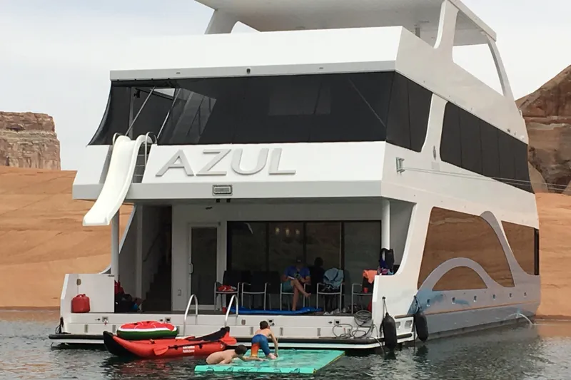 Slide: The Image of Luxury houseboat "Azul" with slide, kayaks, and people enjoying water activities. - 40