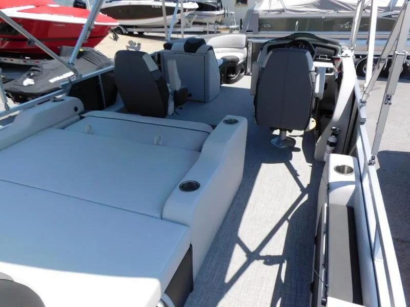 Slide: The Image of 2023 Avalon 2385 LSZ VRL pontoon boat interior with seating and helm. - 6