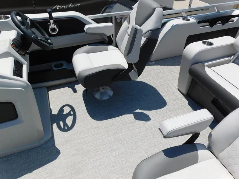 Slide: The Image of 2023 Avalon 2385 LSZ VRL boat interior with modern seating and steering wheel. - 9