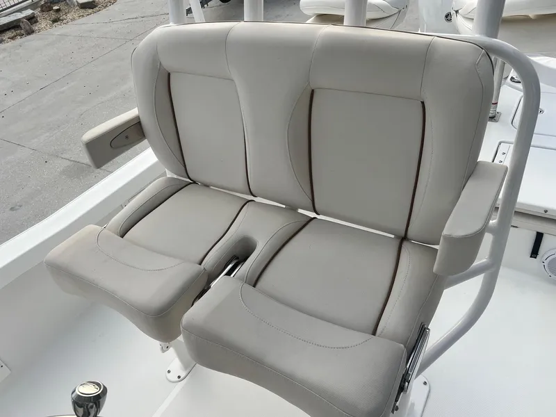 Slide: The Image of 2022 Sea Hunt BX 25 BR boat seating, beige upholstery, dual seats with armrests. - 10