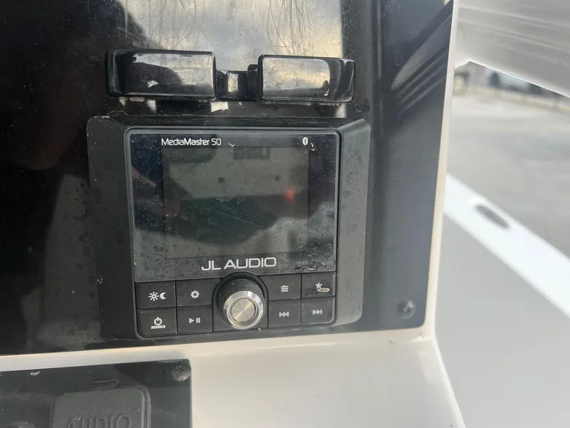 Slide: The Image of JL Audio MediaMaster 50 on 2022 Sea Hunt BX 25 BR boat dashboard. - 14