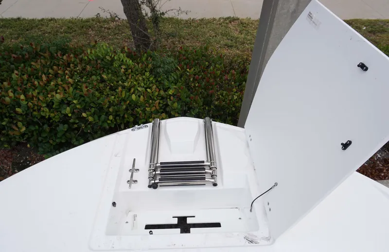 Slide: The Image of 2024 Hurricane 218 SS boat with folded stainless steel ladder. - 11