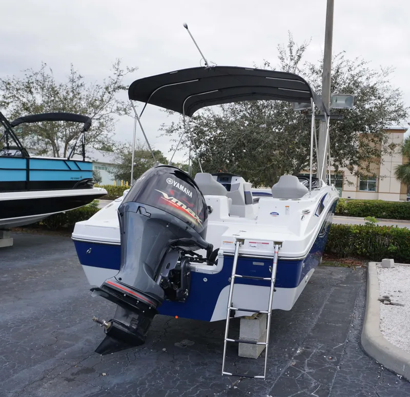 Slide: The Image of 2024 Hurricane 218 SS boat with Yamaha outboard motor and ladder. - 12