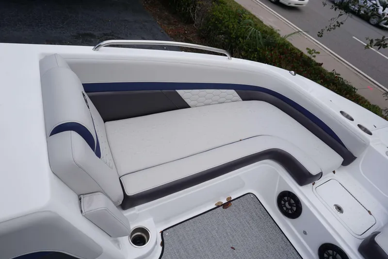 Slide: The Image of 2024 Hurricane 218 SS boat interior seating with white and blue upholstery. - 7