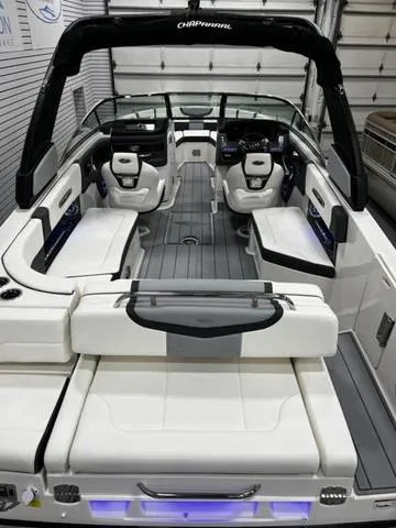 Slide: The Image of 2024 Chaparral 287 SSX boat interior with luxurious seating and modern dashboard. - 13