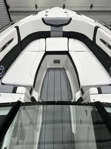 Slide: The Image of 2024 Chaparral 287 SSX boat interior with white and black seating. - 16