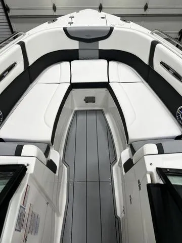 Slide: The Image of 2024 Chaparral 287 SSX boat interior with white and black seating. - 17