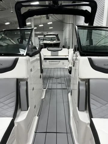Slide: The Image of 2024 Chaparral 287 SSX boat interior with modern seating and sleek design. - 18