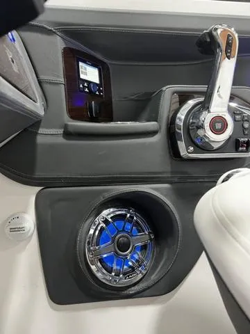 Slide: The Image of 2024 Chaparral 287 SSX boat dashboard with control panel and speaker. - 25