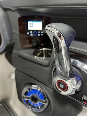 Slide: The Image of 2024 Chaparral 287 SSX boat control panel with throttle and audio system. - 26