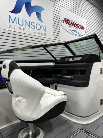 Slide: The Image of 2024 Chaparral 287 SSX boat interior with captain's chair and dashboard. - 28