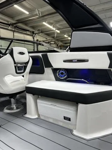 Slide: The Image of 2024 Chaparral 287 SSX boat interior with white and black seating, modern design. - 31