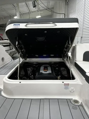 Slide: The Image of 2024 Chaparral 287 SSX boat engine compartment with open hatch. - 33