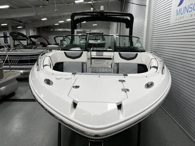 Slide: The Image of 2024 Chaparral 287 SSX boat displayed in a showroom. - 5