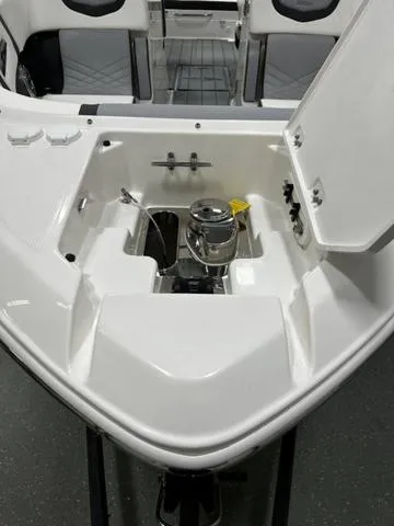 Slide: The Image of 2024 Chaparral 287 SSX boat anchor storage compartment. - 6