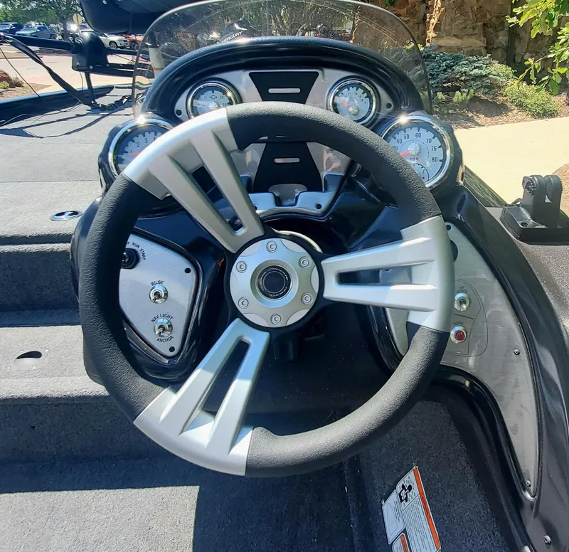 Slide: The Image of Steering wheel and dashboard of 2024 Tracker Pro Team 195 TXW Tournament Edition boat. - 3