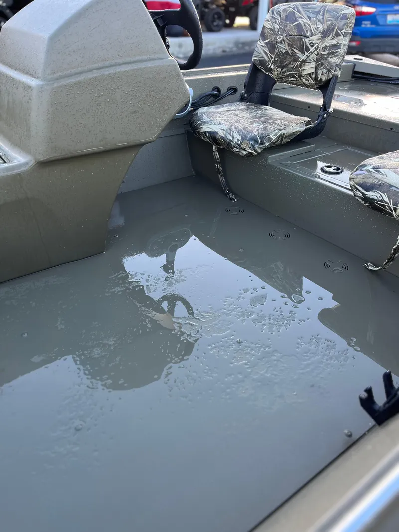Slide: The Image of 2024 Tracker Grizzly 1754 SC boat interior with water accumulation. - 5
