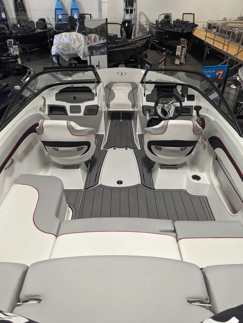 Slide: The Image of 2024 Tahoe 210 Si boat interior with sleek seating and modern dashboard design. - 4