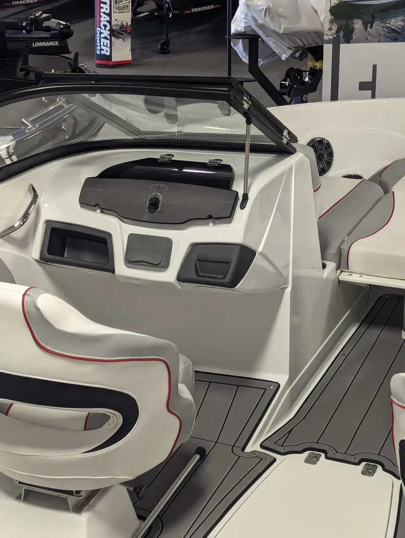 Slide: The Image of 2024 Tahoe 210 Si boat interior with modern seating and dashboard design. - 5