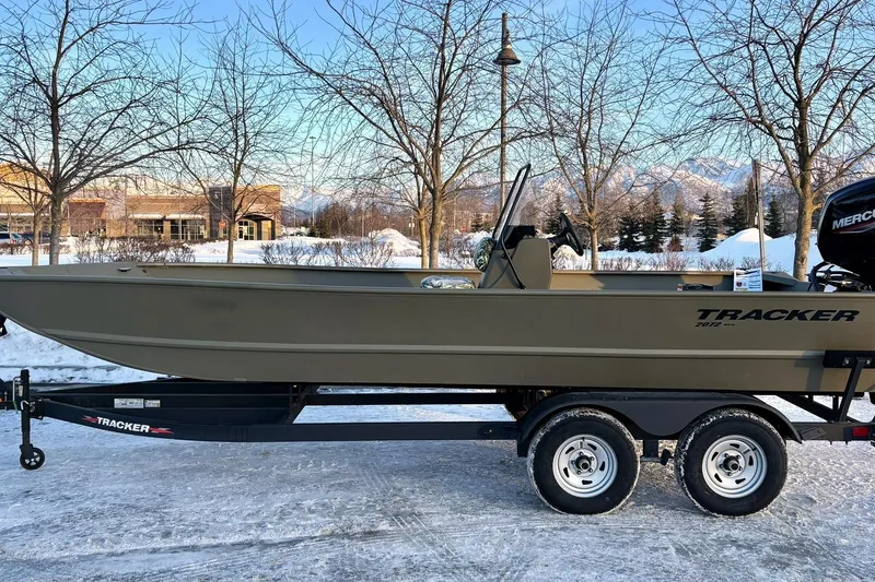 Slide: The Image of 2024 Tracker Grizzly 2072 CC boat on trailer in winter. - 13