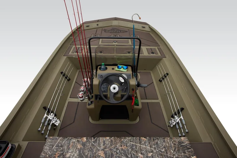 Slide: The Image of 2024 Tracker Grizzly 2072 CC boat interior with fishing rods and steering console. - 33