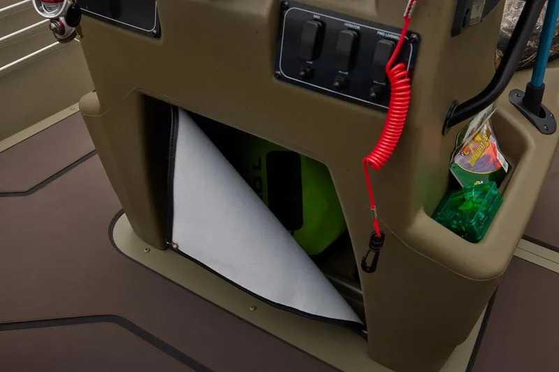 Slide: The Image of 2024 Tracker Grizzly 2072 CC boat console with storage and control panel. - 36