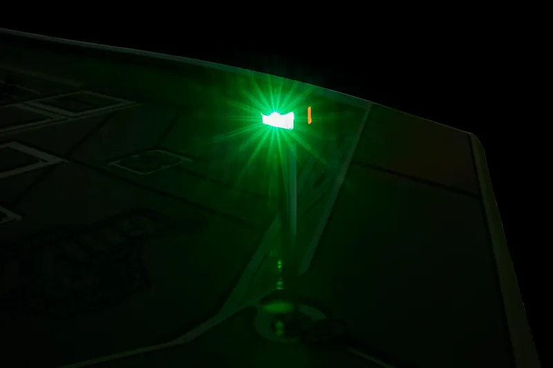 Slide: The Image of Green navigation light on 2024 Tracker Grizzly 2072 CC boat at night. - 49