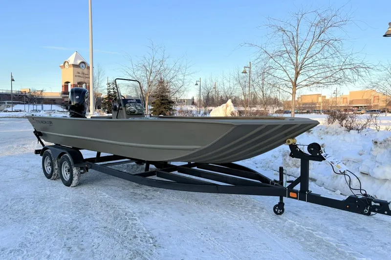 Slide: The Image of 2024 Tracker Grizzly 2072 CC boat on trailer in snowy parking lot. - 5
