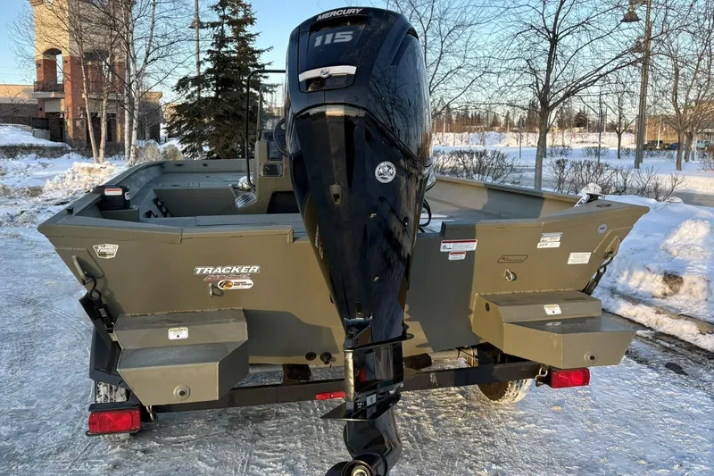 Slide: The Image of 2024 Tracker Grizzly 2072 CC boat parked in snow. - 6