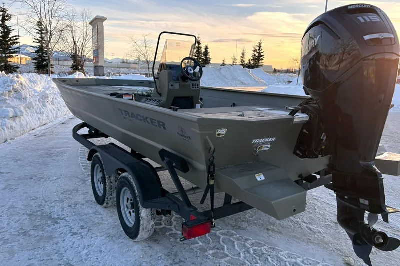 Slide: The Image of 2024 Tracker Grizzly 2072 CC boat on snowy parking lot. - 8