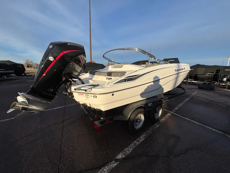 Slide: The Image of 2024 Tahoe T21 boat on trailer in parking lot, rear view. - 4
