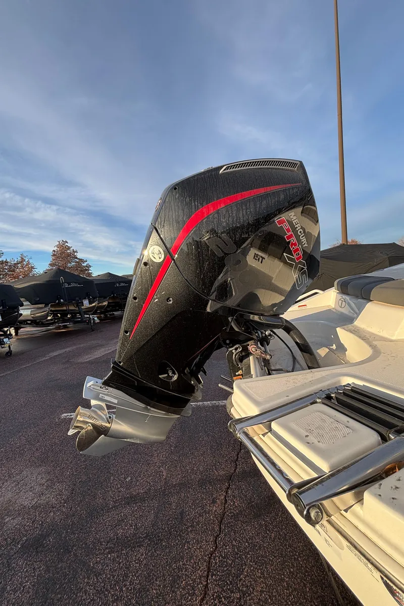 Slide: The Image of 2024 Tahoe T21 boat with sleek black and red outboard motor. - 8