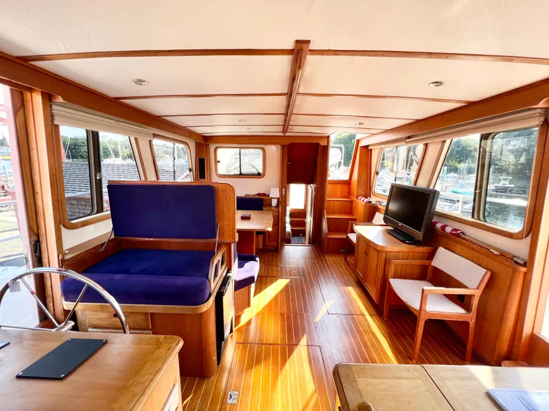 Slide: The Image of Interior of 2001 Sabre Sabreline 47 yacht with wooden flooring and seating. - 10