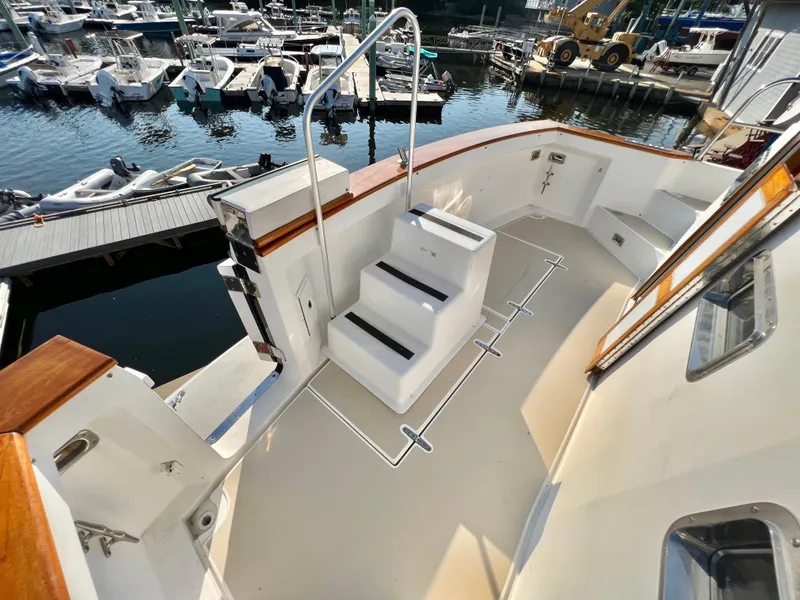 Slide: The Image of Sabreline 47 yacht deck with steps, docked at marina, 2001 model. - 27