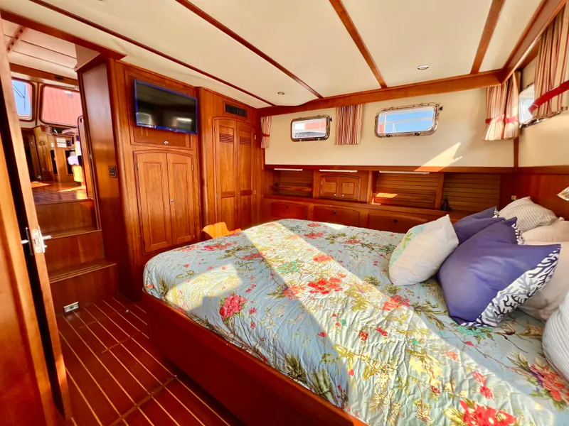 Slide: The Image of Luxurious master cabin of 2001 Sabre Sabreline 47 yacht with floral bedding. - 3