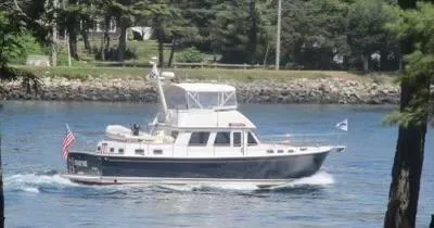 Slide: The Image of 2001 Sabre Sabreline 47 yacht cruising on a calm river. - 34