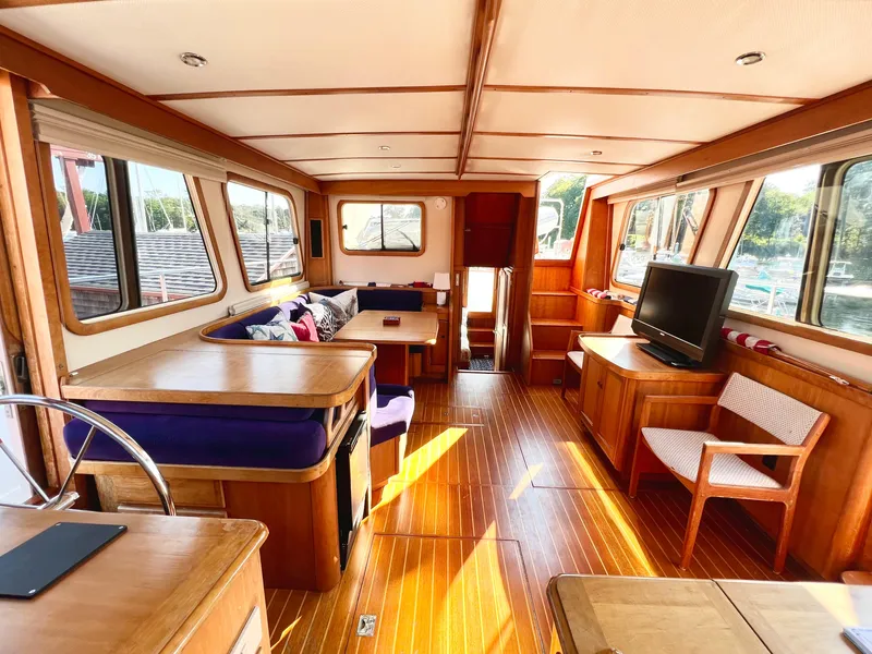 Slide: The Image of Interior of 2001 Sabre Sabreline 47 yacht with wooden flooring and modern furnishings. - 11